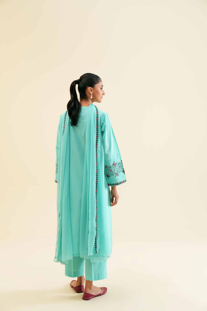 Stylish 3 piece embroidered turquoise cambric shirt with dupatta and trouser