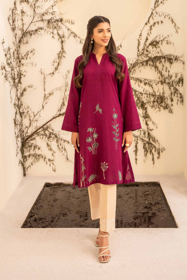 A stunning maroon embroidered kurta suit, showcasing exquisite craftsmanship and elegance.